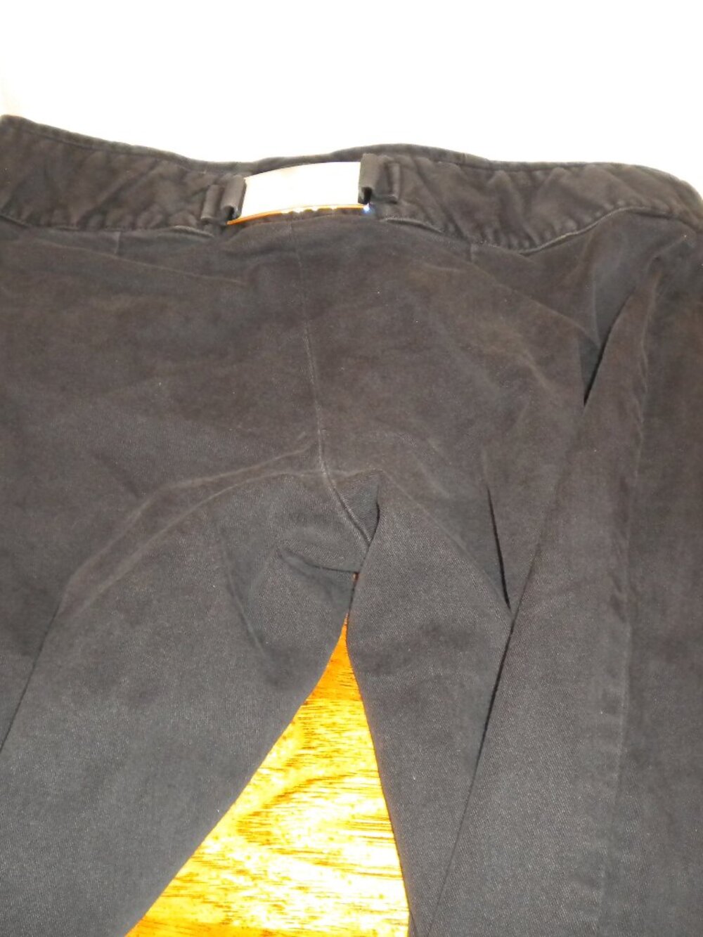 Authentic Dolce & Gabbana Black Stretch Pants with Metal Logo Plate